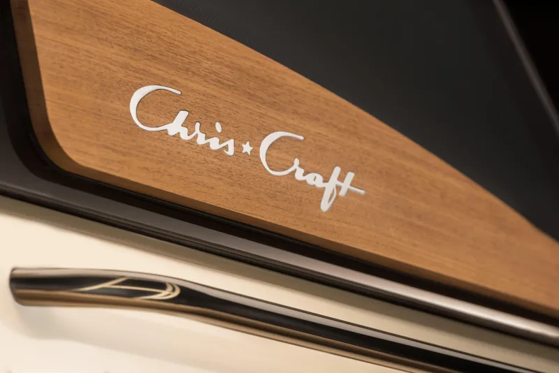 Slide: The Image of Chris-Craft Catalina 30, 2025 model, featuring elegant wood and chrome detailing. - 14