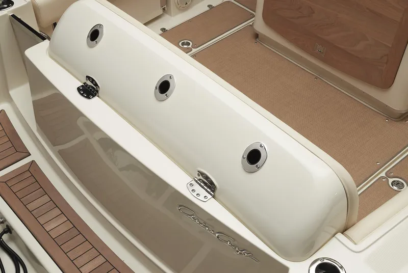 Slide: The Image of 2025 Chris-Craft Catalina 30 boat interior with beige flooring and wood accents. - 18