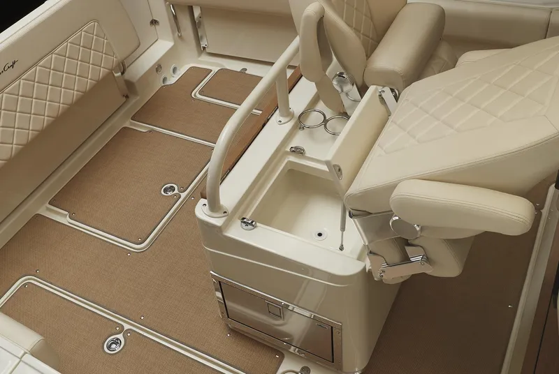 Slide: The Image of 2025 Chris-Craft Catalina 30 interior with beige seating and storage compartments. - 19