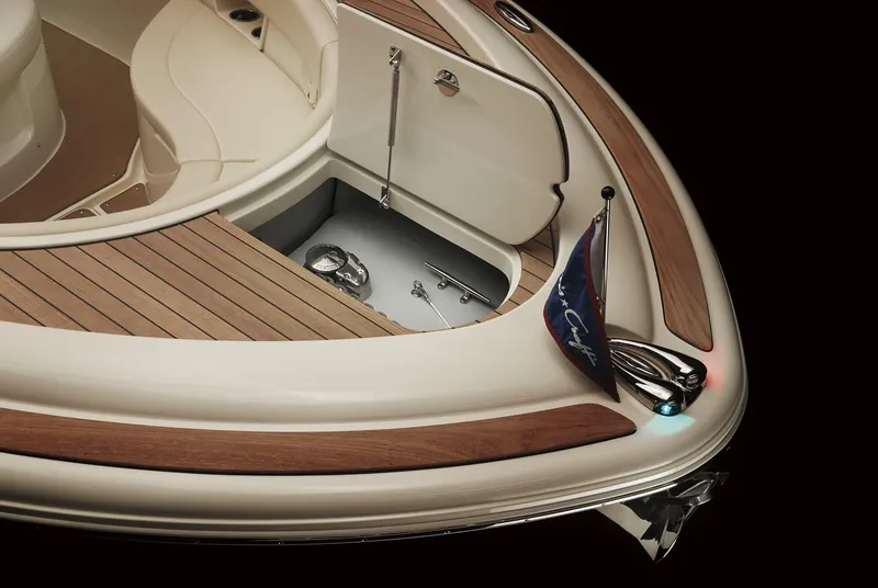 Slide: The Image of 2025 Chris-Craft Catalina 30 boat deck with storage compartment and flag. - 6