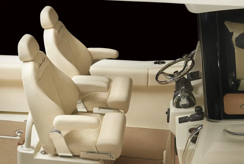 Slide: The Image of Luxurious interior of 2025 Chris-Craft Catalina 30 with plush seating and sleek controls. - 9