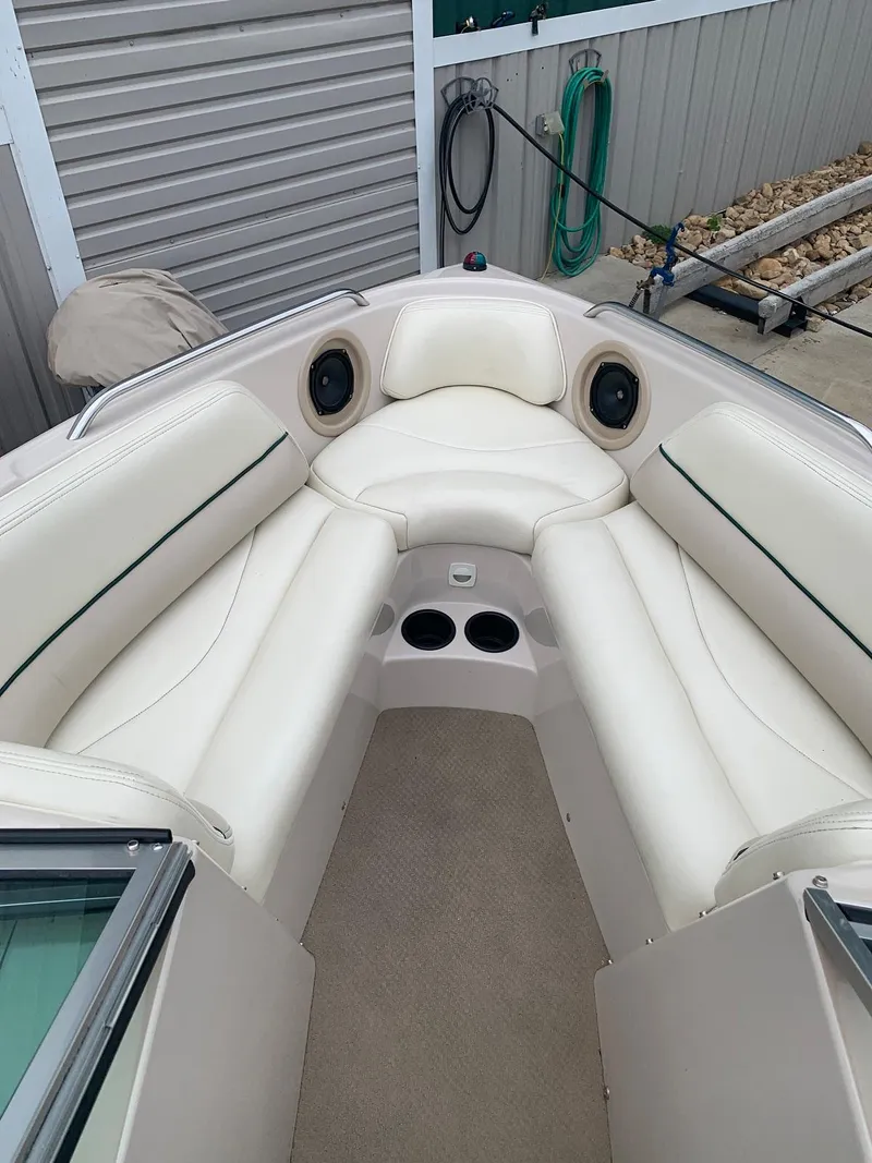 Slide: The Image of Interior of a 1999 MasterCraft MariStar 210 boat with white seating. - 21