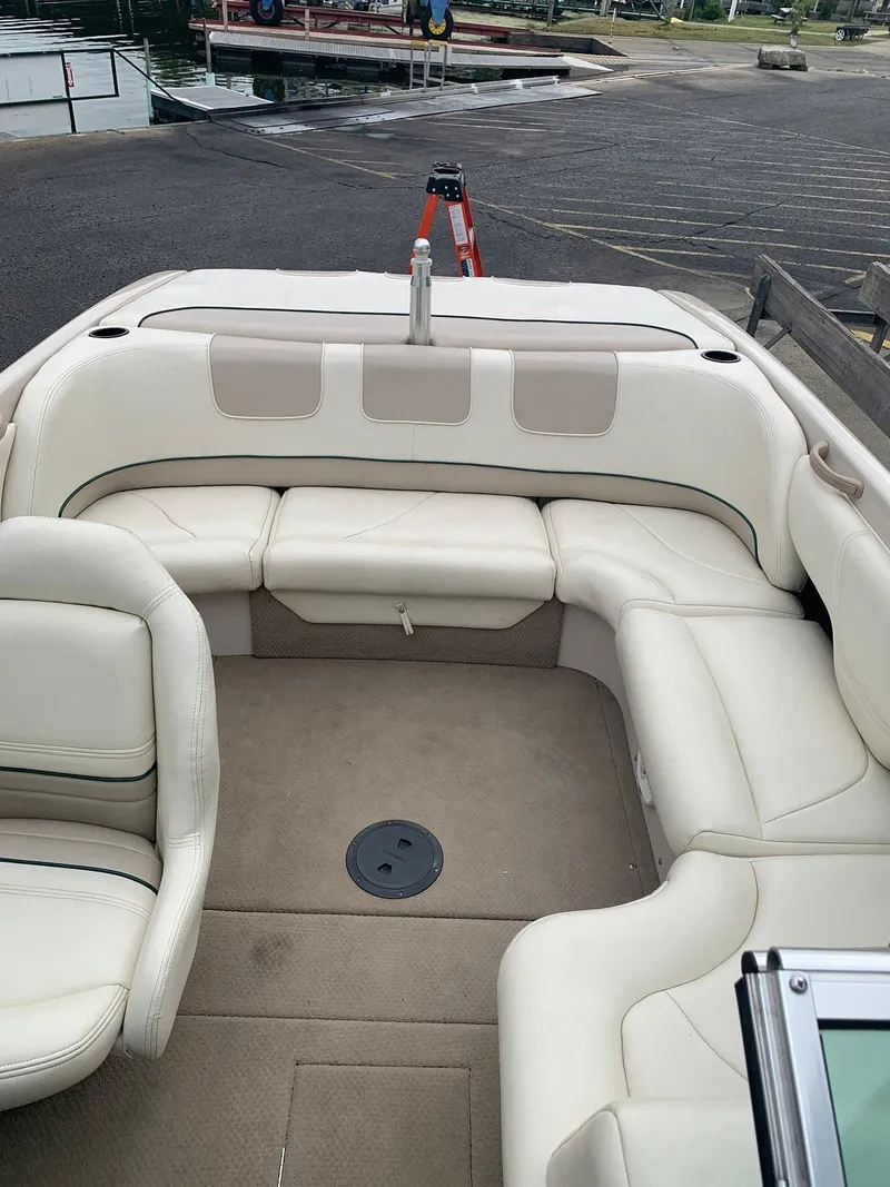 Slide: The Image of Interior of a 1999 MasterCraft MariStar 210 boat with white leather seating. - 24