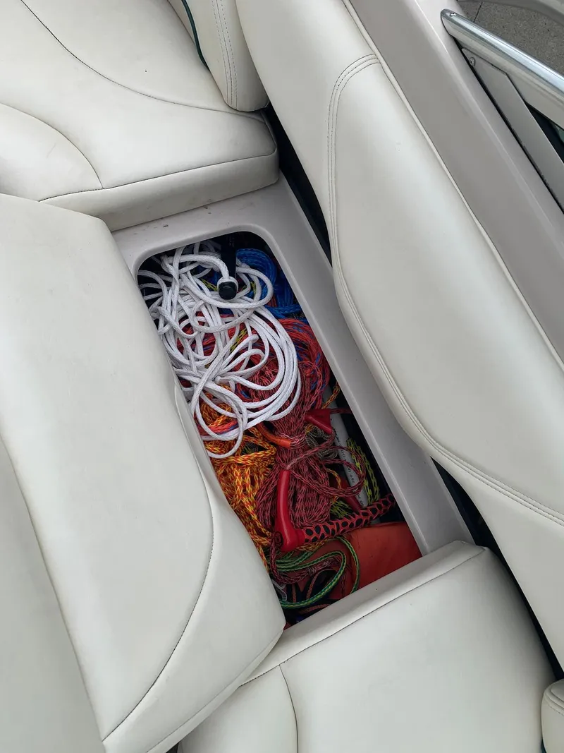 Slide: The Image of Storage compartment in 1999 MasterCraft MariStar 210 boat with ropes. - 27