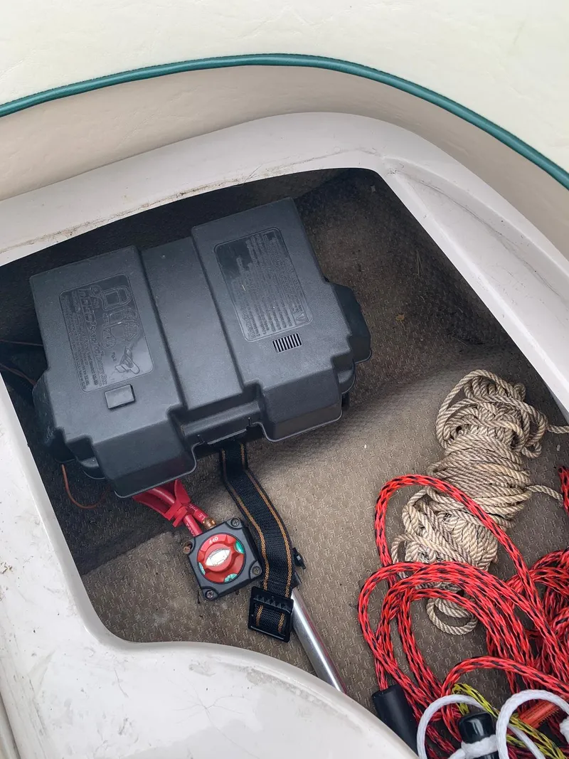 Slide: The Image of Battery compartment of 1999 MasterCraft MariStar 210 with ropes and cables. - 28