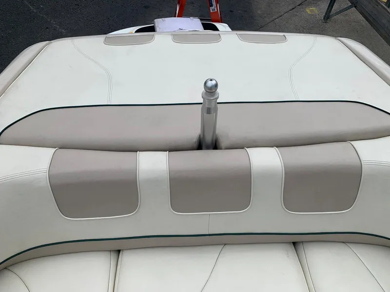 Slide: The Image of Rear view of 1999 MasterCraft MariStar 210 boat with beige upholstery. - 30