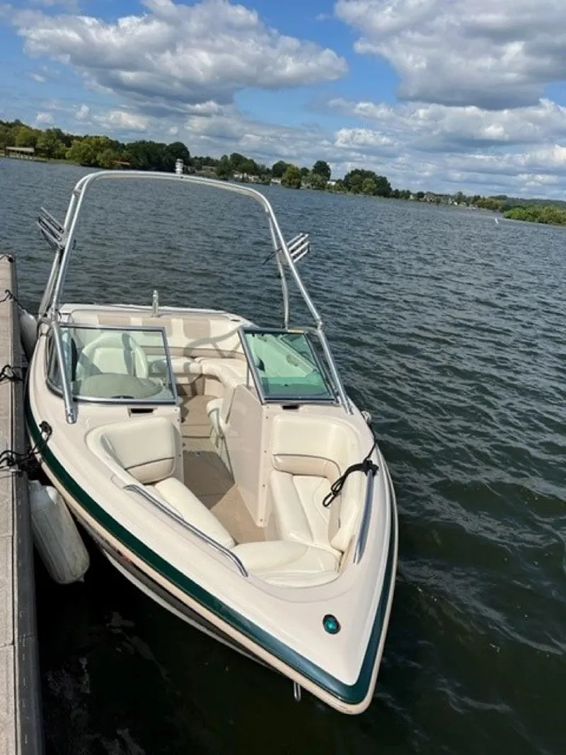Slide: The Image of 1999 MasterCraft MariStar 210 boat docked at lakeside. - 5