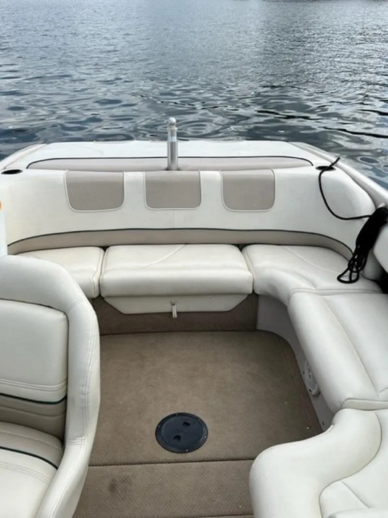 Slide: The Image of Interior of a 1999 MasterCraft MariStar 210 boat on calm water. - 6