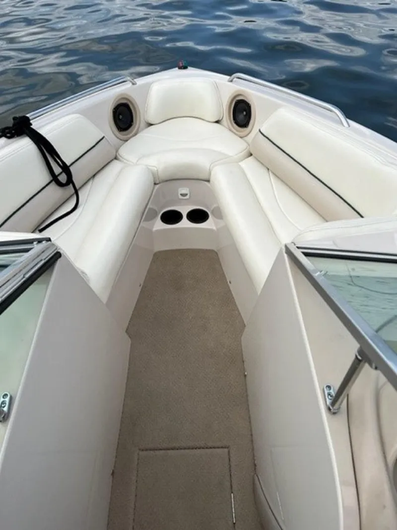 Slide: The Image of Interior of a 1999 MasterCraft MariStar 210 boat with white seating. - 8