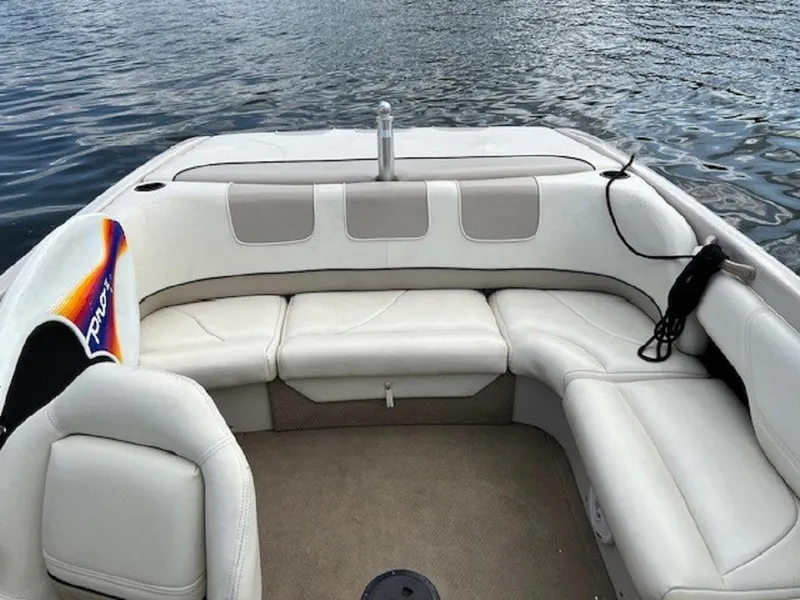 Slide: The Image of Interior of a 1999 MasterCraft MariStar 210 boat on the water. - 9