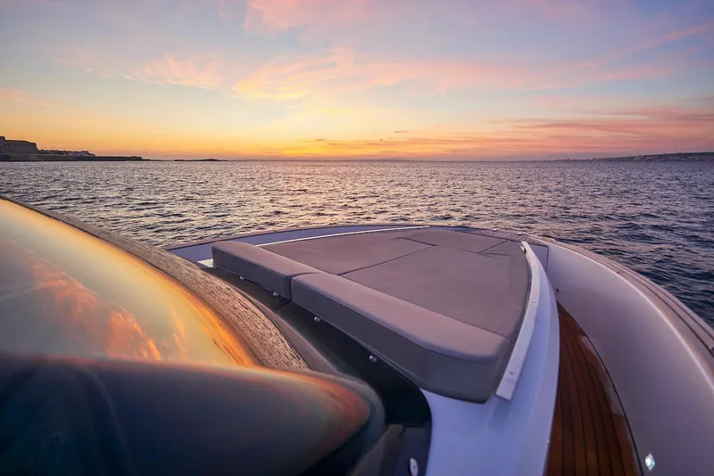 Slide: The Image of 2023 Astondoa 377 Coupe yacht at sunset on the open sea. - 11