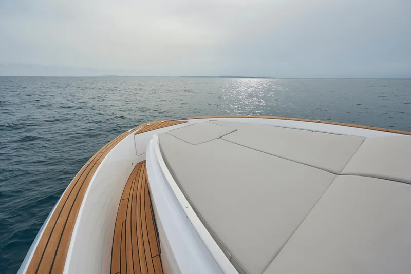Slide: The Image of 2023 Astondoa 377 Coupe yacht bow with sunpad and ocean view. - 12
