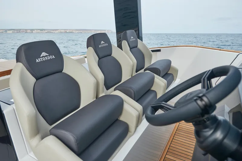 Slide: The Image of 2023 Astondoa 377 Coupe luxury boat seats and steering wheel. - 15