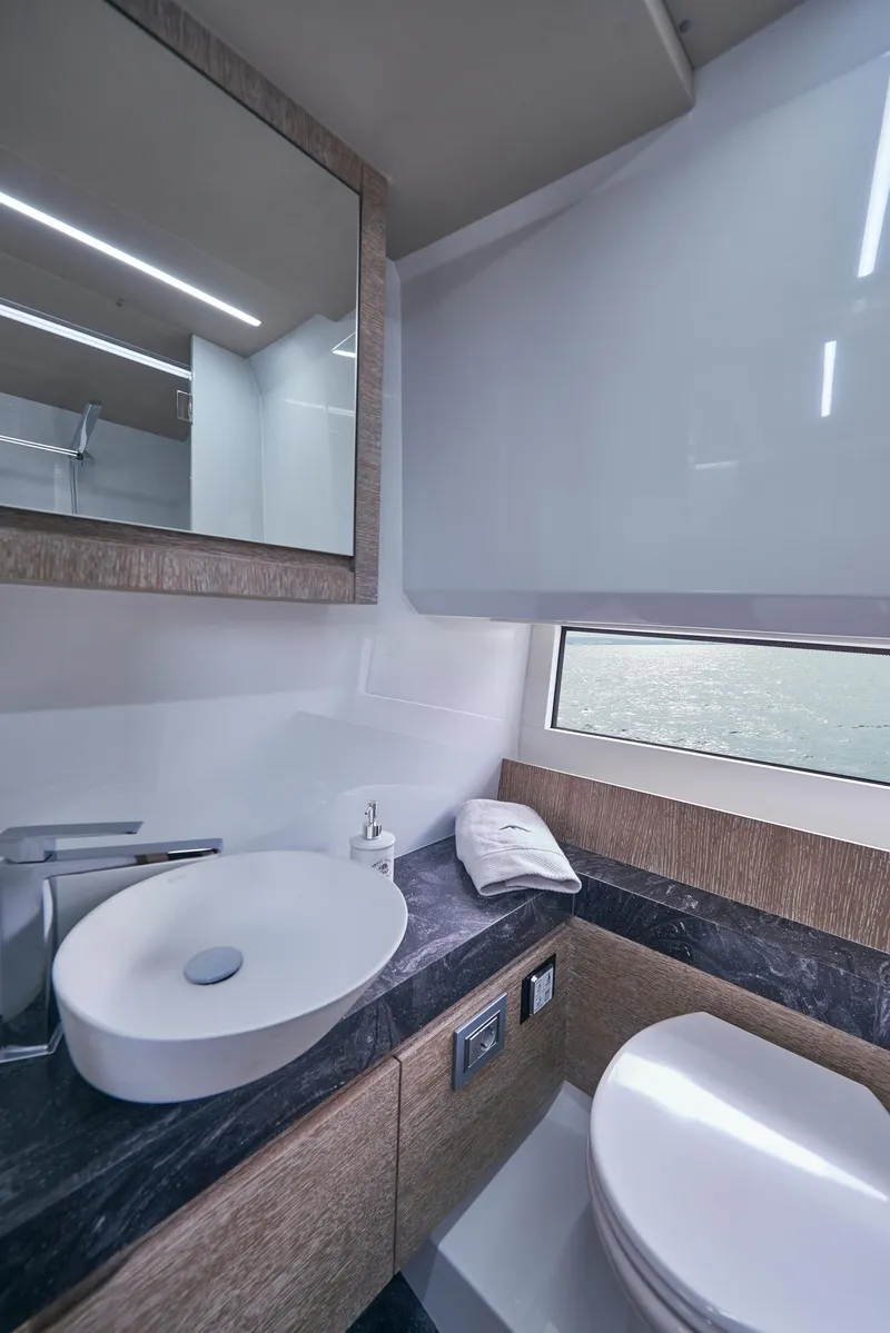 Slide: The Image of Modern bathroom in 2023 Astondoa 377 Coupe yacht with sleek sink and toilet. - 23