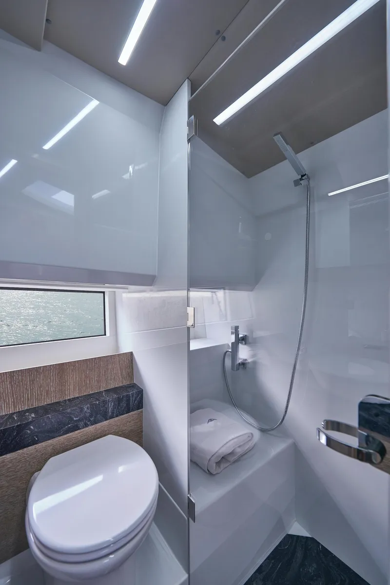 Slide: The Image of Modern bathroom in 2023 Astondoa 377 Coupe yacht with sleek shower and toilet. - 24
