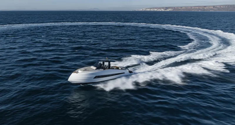 Slide: The Image of 2023 Astondoa 377 Coupe making a turn on open water. - 6