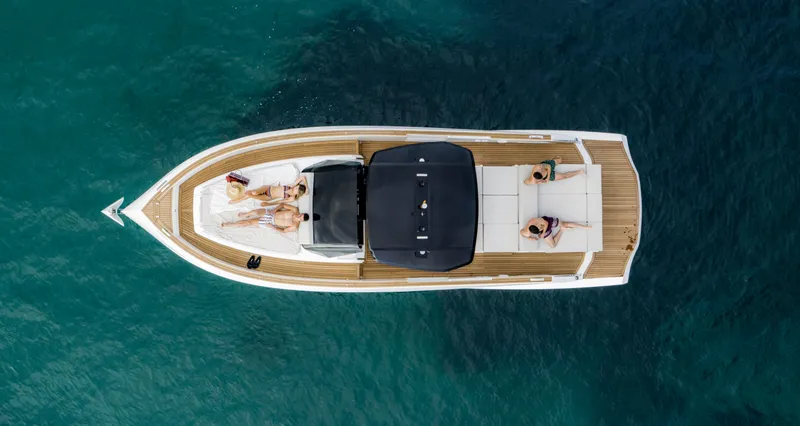 Slide: The Image of 2023 Astondoa 377 Coupe luxury yacht, aerial view, people sunbathing on deck. - 8