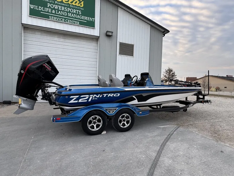 Slide: The Image of 2023 Nitro Z21 XL Pro boat parked outside service center. - 38