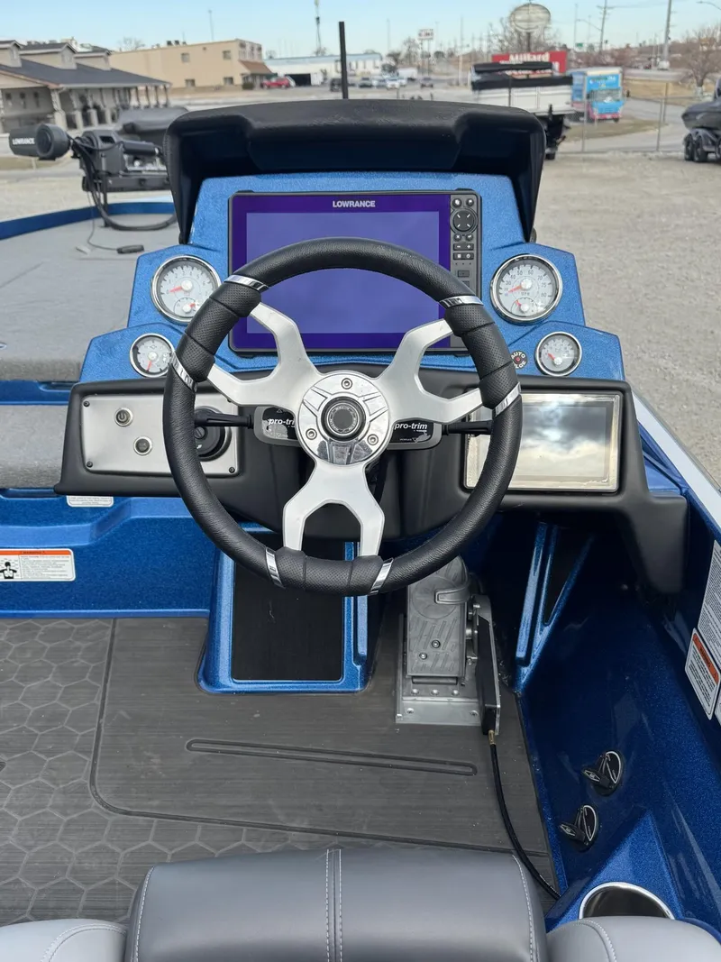 Slide: The Image of 2023 Nitro Z21 XL Pro boat dashboard with steering wheel and digital display. - 41