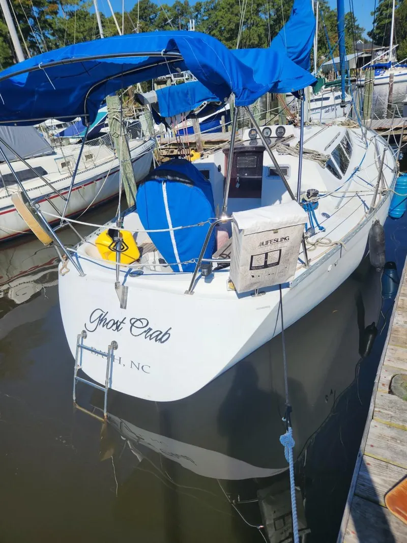 The Image of 1984 Elite 32 sailboat named Ghost Crab docked at a marina. - 0