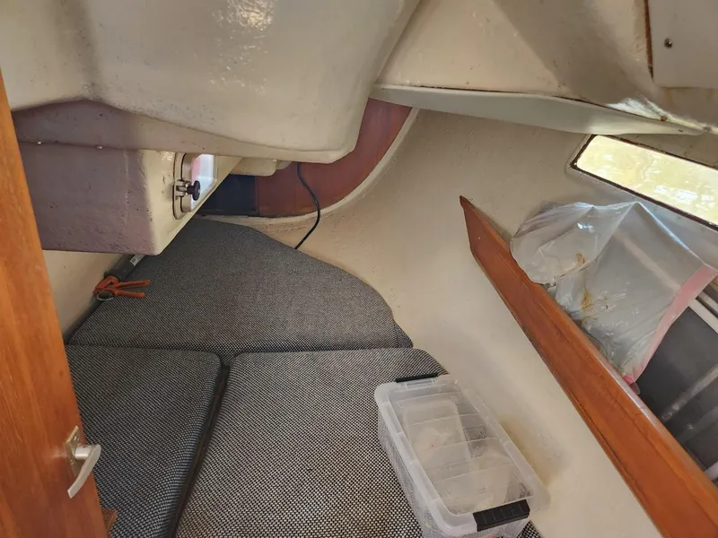 Slide: The Image of Interior cabin of 1984 Elite 32 sailboat with storage and seating area. - 10