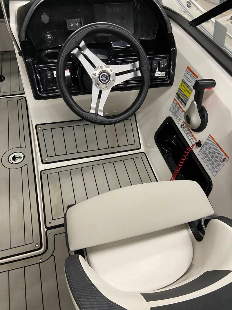 Slide: The Image of 2020 Yamaha Boats 195S cockpit with steering wheel and control panel. - 2