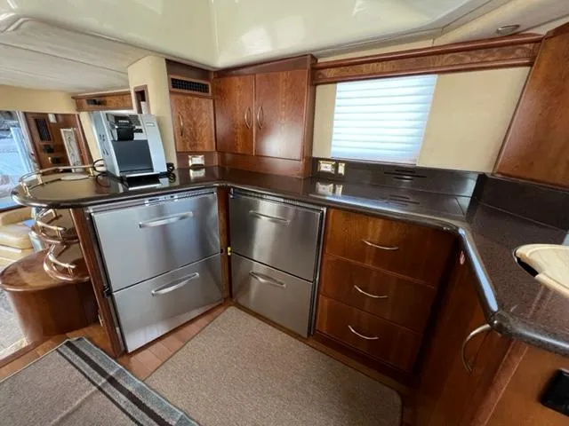Slide: The Image of Modern kitchen in a 2009 Ovation 52 yacht with stainless steel appliances. - 12