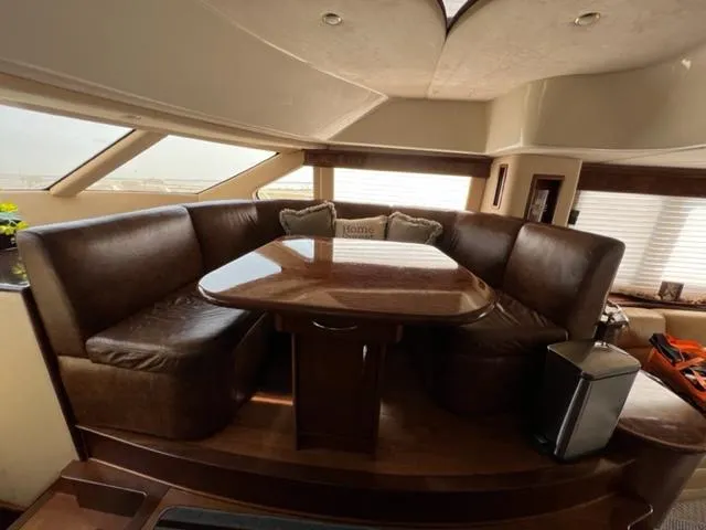 Slide: The Image of Luxurious 2009 Ovation 52 yacht interior with leather seating and dining table. - 14