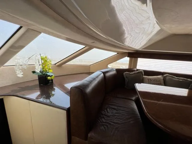 Slide: The Image of Luxurious interior of 2009 Ovation 52 yacht with leather seating and decorative pillows. - 15