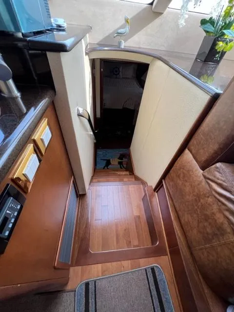 Slide: The Image of 2009 Ovation 52 yacht interior with wooden stairs and modern decor. - 18
