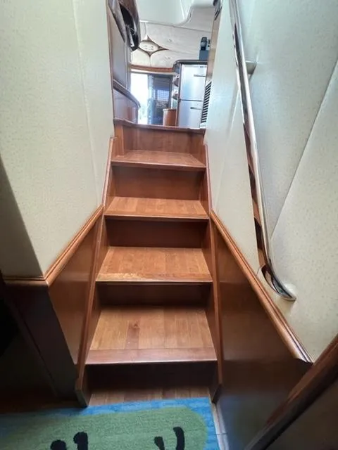 Slide: The Image of Wooden staircase inside a 2009 Ovation 52 yacht. - 29