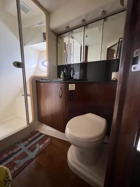 Slide: The Image of 2009 Ovation 52 yacht bathroom with shower, vanity, and toilet. - 31