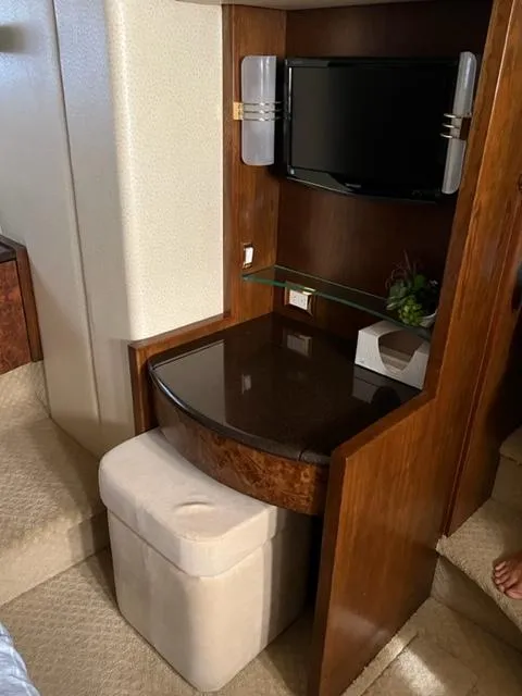 Slide: The Image of 2009 Ovation 52 yacht interior with TV and vanity desk. - 36