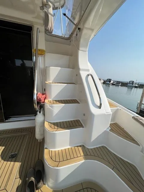 Slide: The Image of Staircase on a 2009 Ovation 52 yacht with marina view. - 37