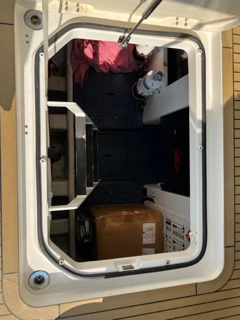 Slide: The Image of Engine compartment of a 2009 Ovation 52 yacht with storage and equipment. - 38