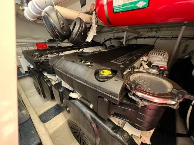 Slide: The Image of Engine room of a 2009 Ovation 52 yacht with dual engines and fire suppression system. - 42