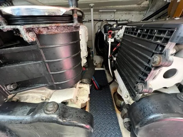 Slide: The Image of Engine compartment of a 2009 Ovation 52 boat with visible components and machinery. - 43