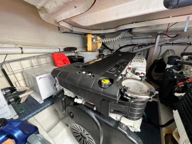 Slide: The Image of Engine room of a 2009 Ovation 52 yacht with visible machinery and components. - 44