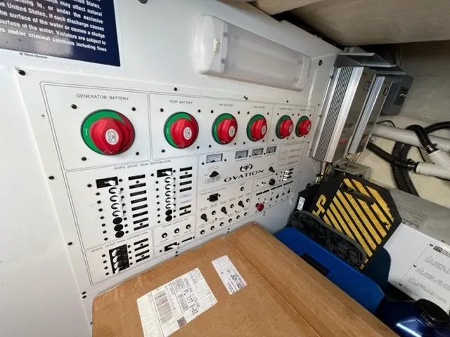 Slide: The Image of Control panel of a 2009 Ovation 52 boat with various switches and dials. - 45