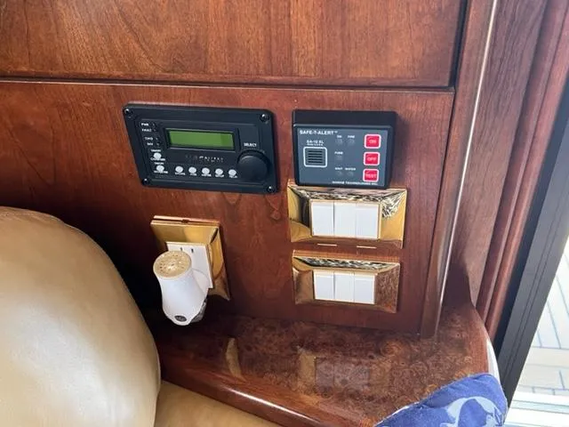 Slide: The Image of Control panel and switches in a 2009 Ovation 52 yacht interior. - 6