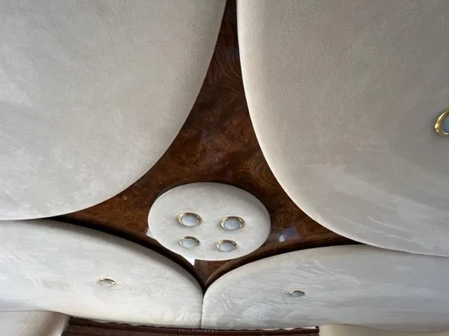 Slide: The Image of Luxurious interior ceiling of a 2009 Ovation 52 with elegant lighting fixtures. - 9