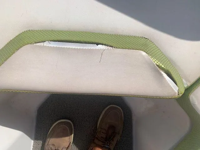 Slide: The Image of Damaged seat upholstery on a 2014 Scarab 215 boat. - 11
