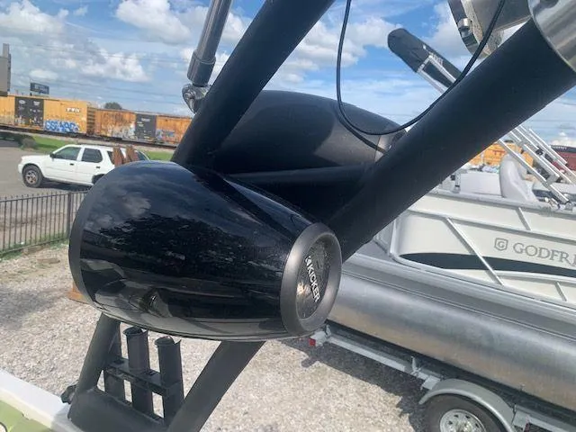 Slide: The Image of Close-up of a 2014 Scarab 215 boat with Kicker speakers. - 14