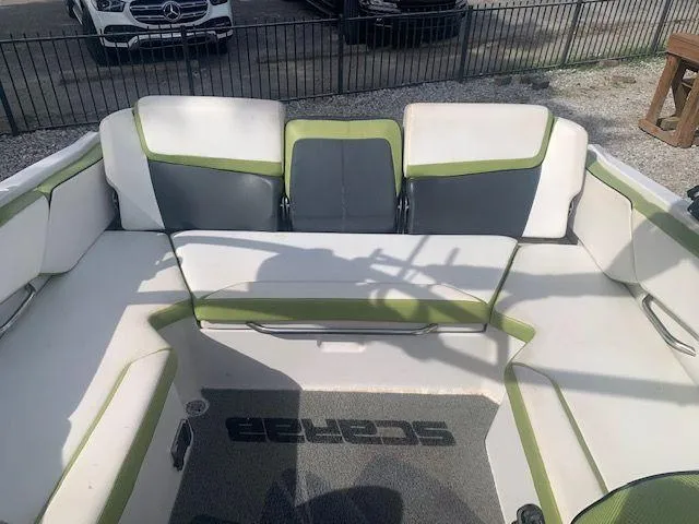 Slide: The Image of 2014 Scarab 215 boat interior with green and white seating. - 7