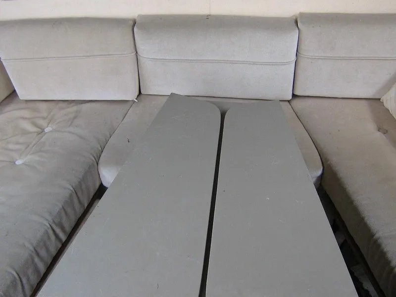 Slide: The Image of Interior seating and table of 1983 Bayliner 2850 Contessa boat. - 10