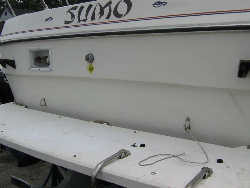 Slide: The Image of 1983 Bayliner 2850 Contessa boat stern with SUMO name. - 13