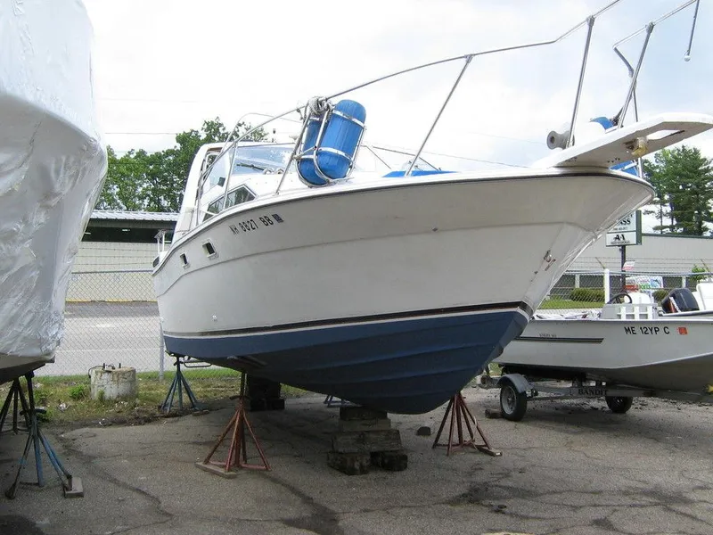Slide: The Image of 1983 Bayliner 2850 Contessa boat on stands in a boatyard. - 6