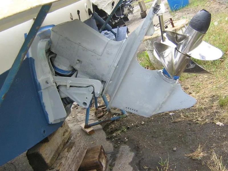 Slide: The Image of 1983 Bayliner 2850 Contessa boat outdrive and propeller in dry dock. - 9