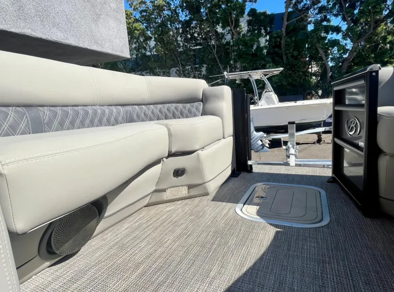 Slide: The Image of 2025 Barletta Lusso 23UC pontoon boat interior with plush seating and modern design. - 12