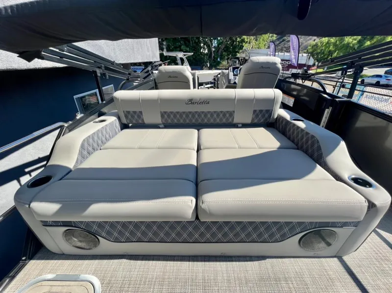 Slide: The Image of 2025 Barletta Lusso 23UC pontoon boat with luxurious seating and modern design. - 13